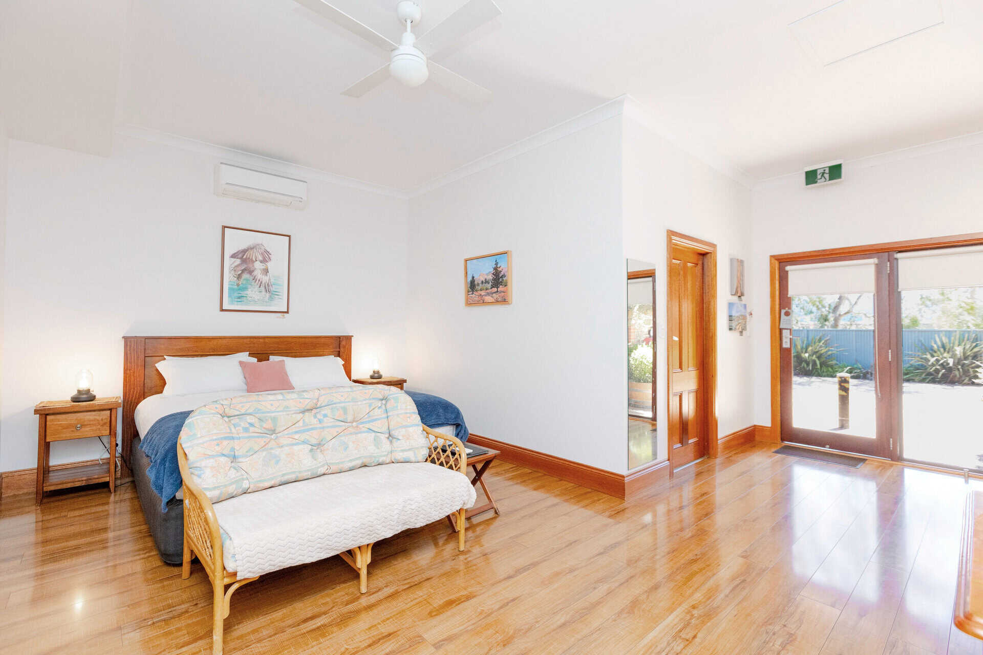 Motel room with King bed and seating area.