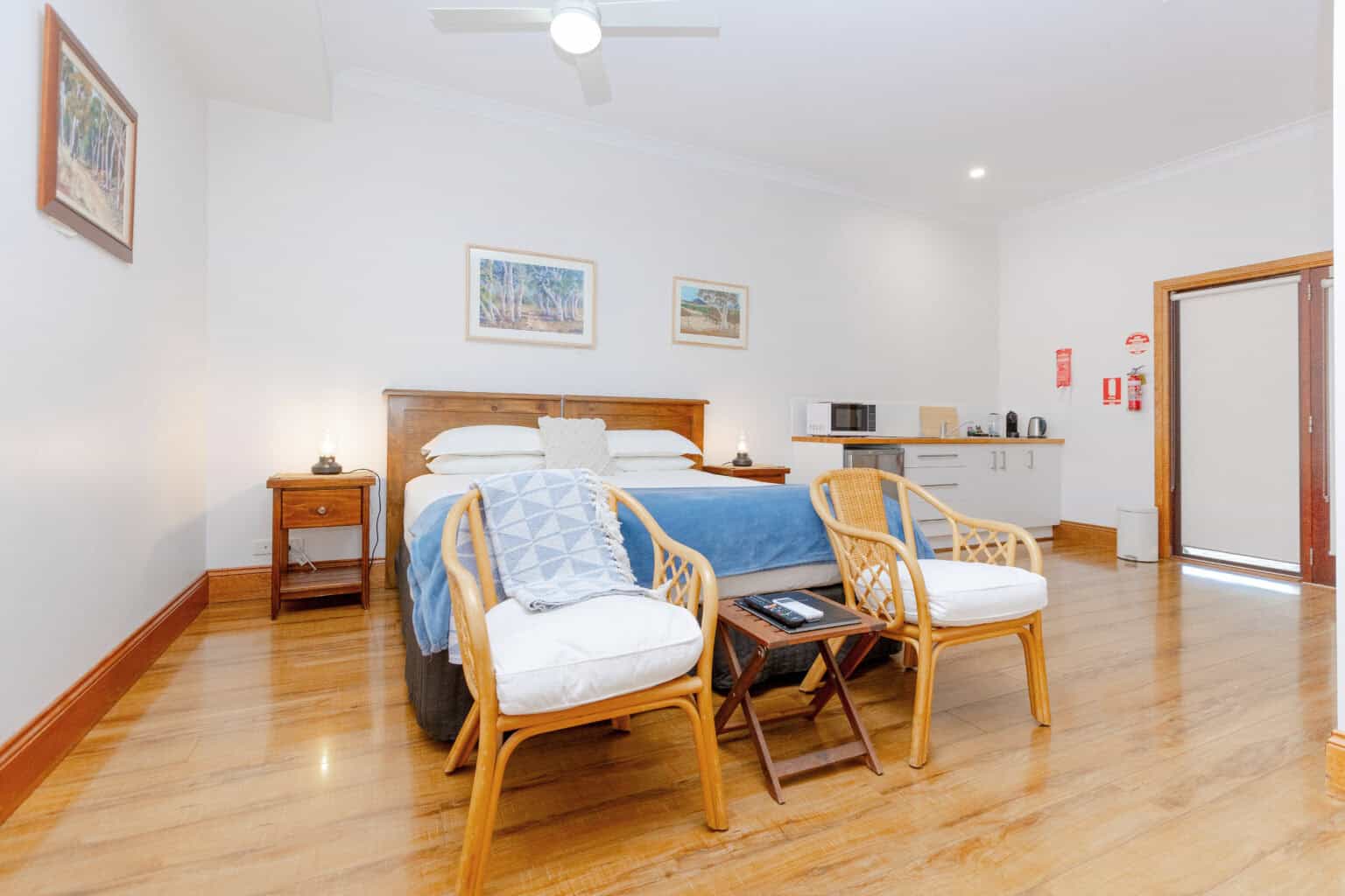 Motel room with King bed and seating area.